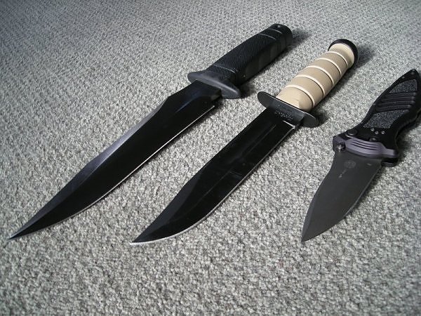 SOG Midnight Tigershark beside 2 other fixed blades (Photo:“Hammer27” - bladeforums)